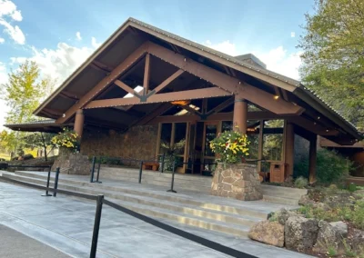 Oregon Geriatrics Society 2025 Conference - Pretty, modern rustic lodge with string lights along the gable edges